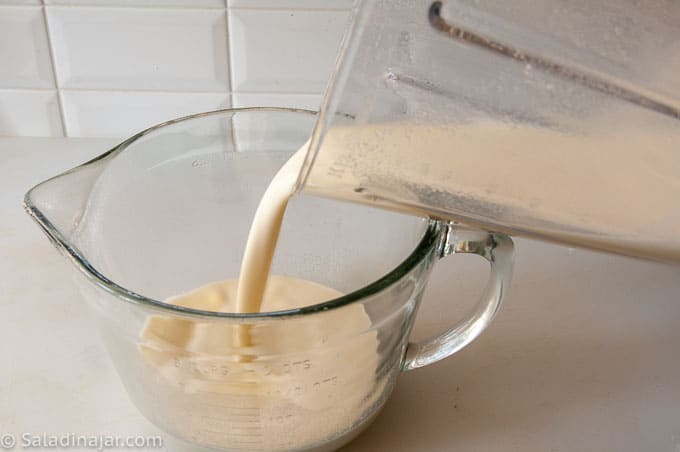 transferring cream mixture from blender to microwave-safe bowl for cooking
