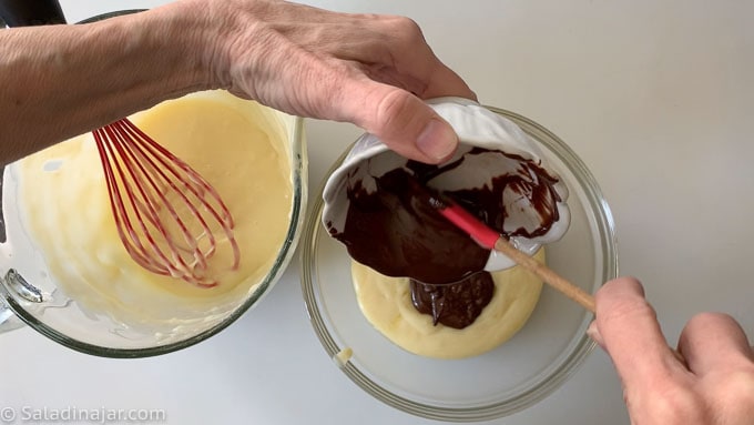 adding melted chocolate to one half of pudding mixture