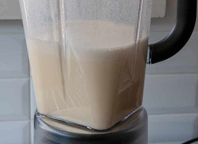 using a blender to combine ingredients for the filling.