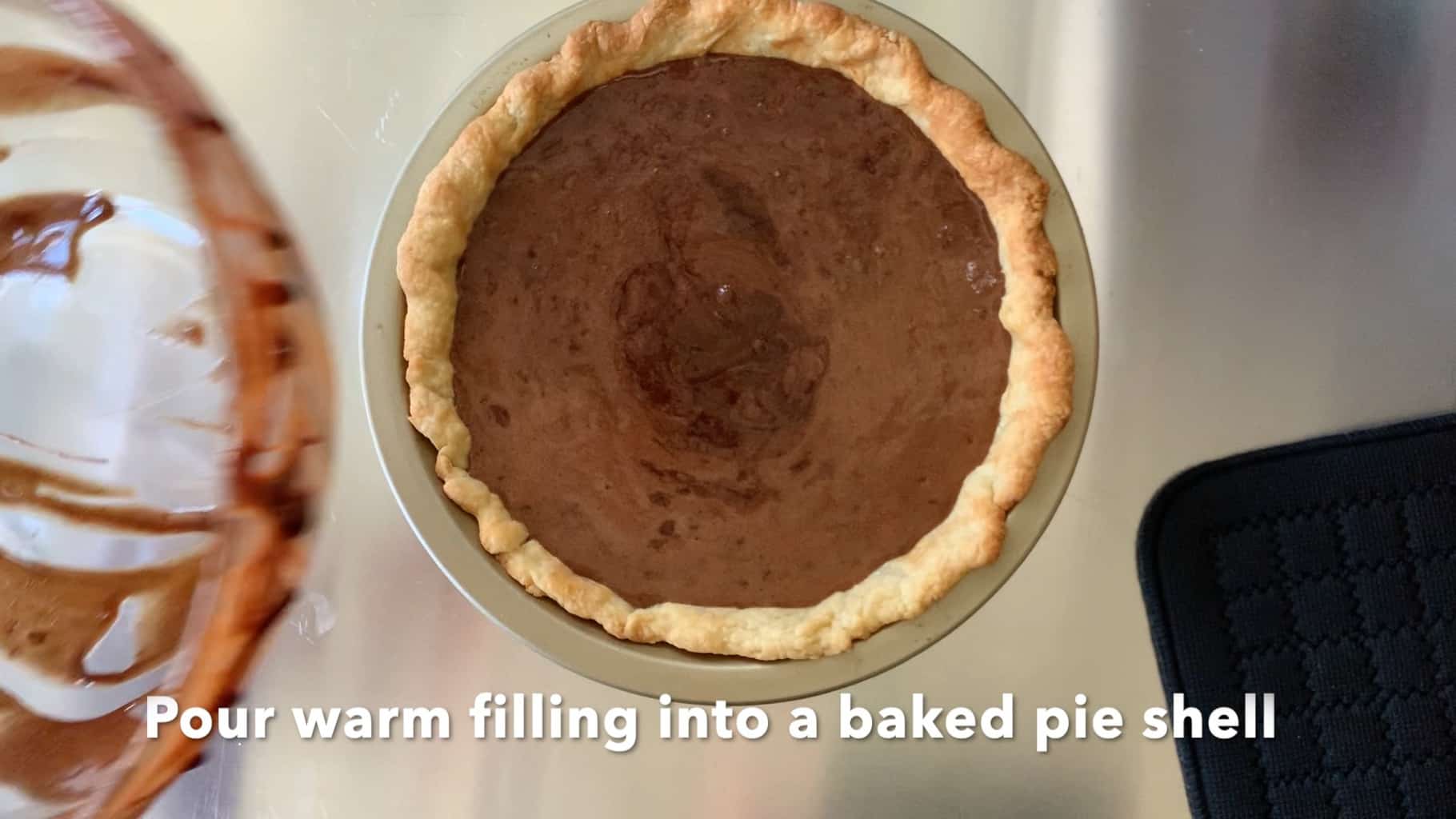 filling in a baked pie shell