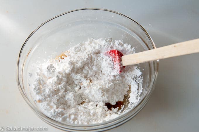 Adding milk, then powdered sugar to make browned butter icing