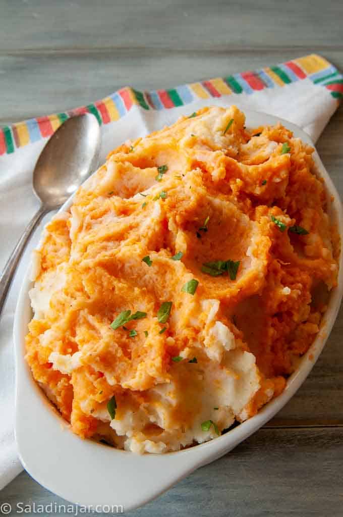 Mashed Sweet and White Potatoes garnished with parsley