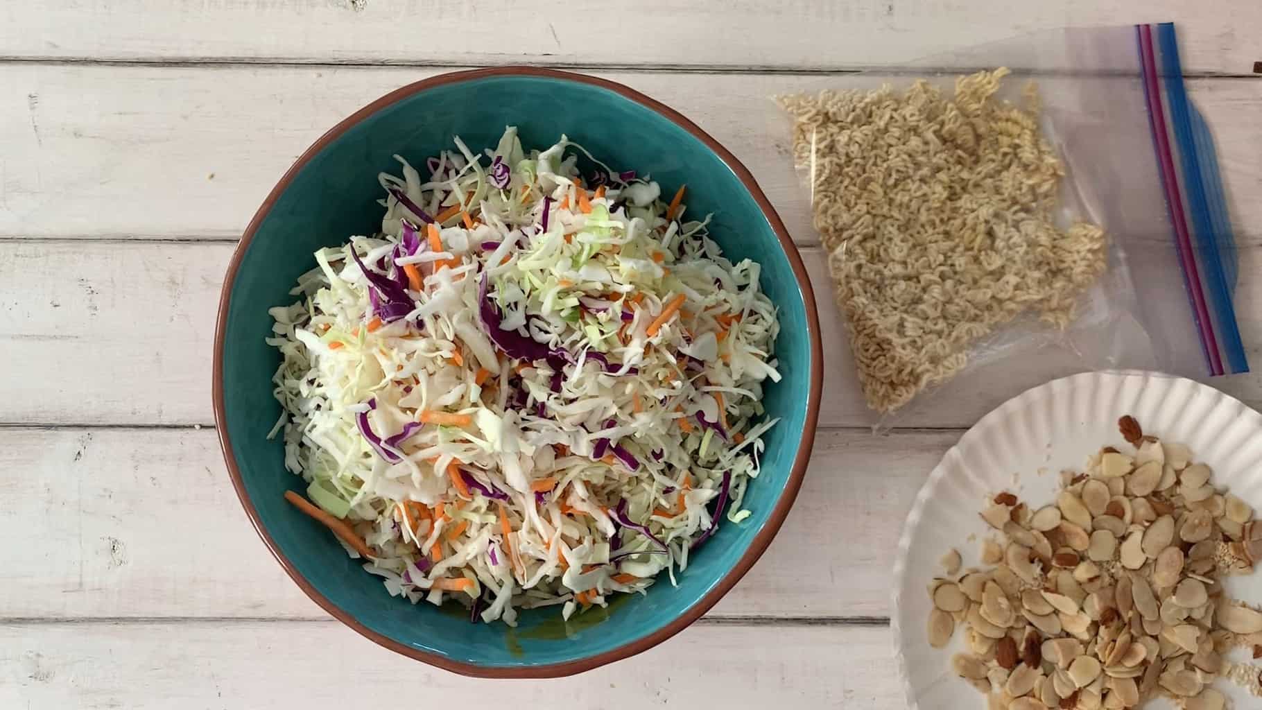 Combining the salad in a large bowl.