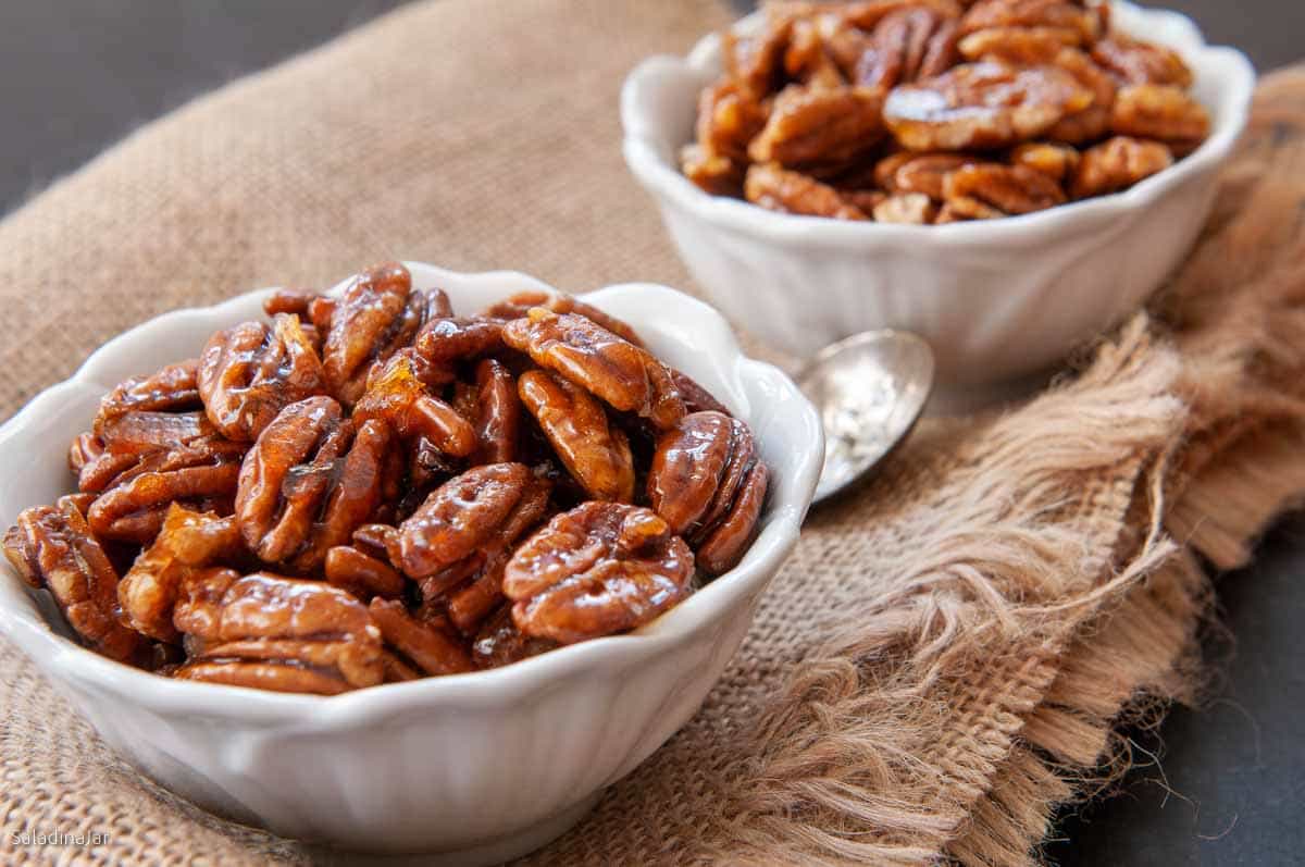 microwave candied pecans in a bowl ready for snacking