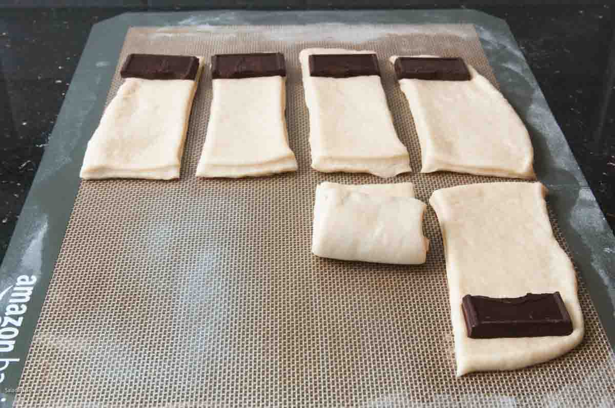 chocolate pieces on rolls before being rolled up