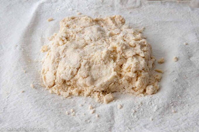dough crumbles on a floured towel