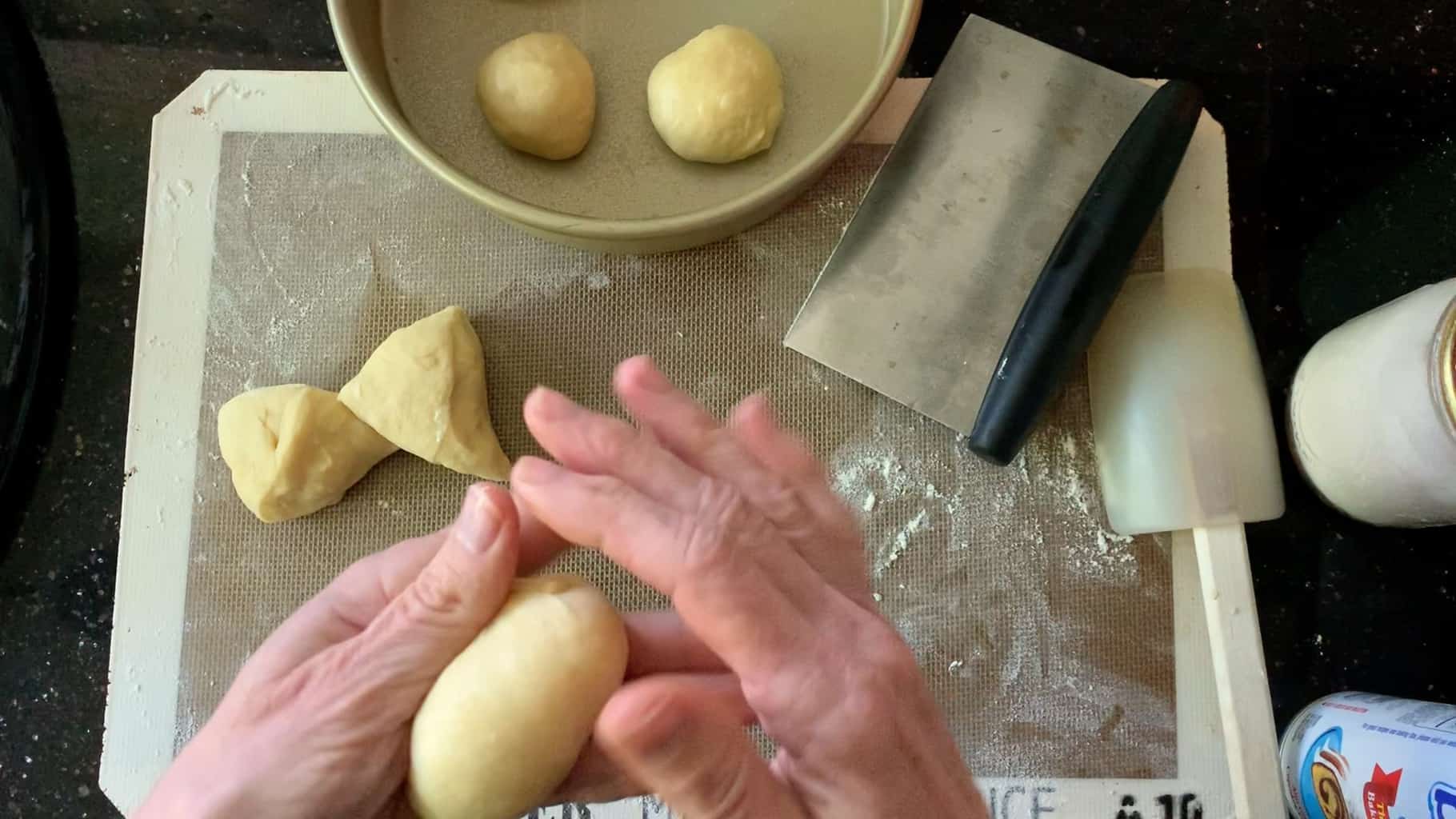 shaping dough into balls