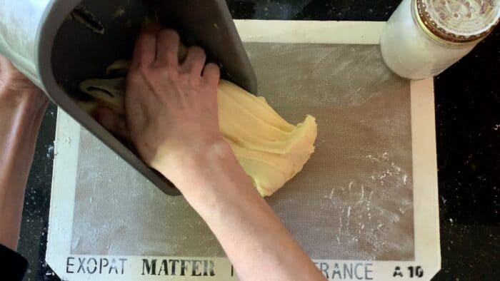 Pull the dough out of the pan onto a floured surface.