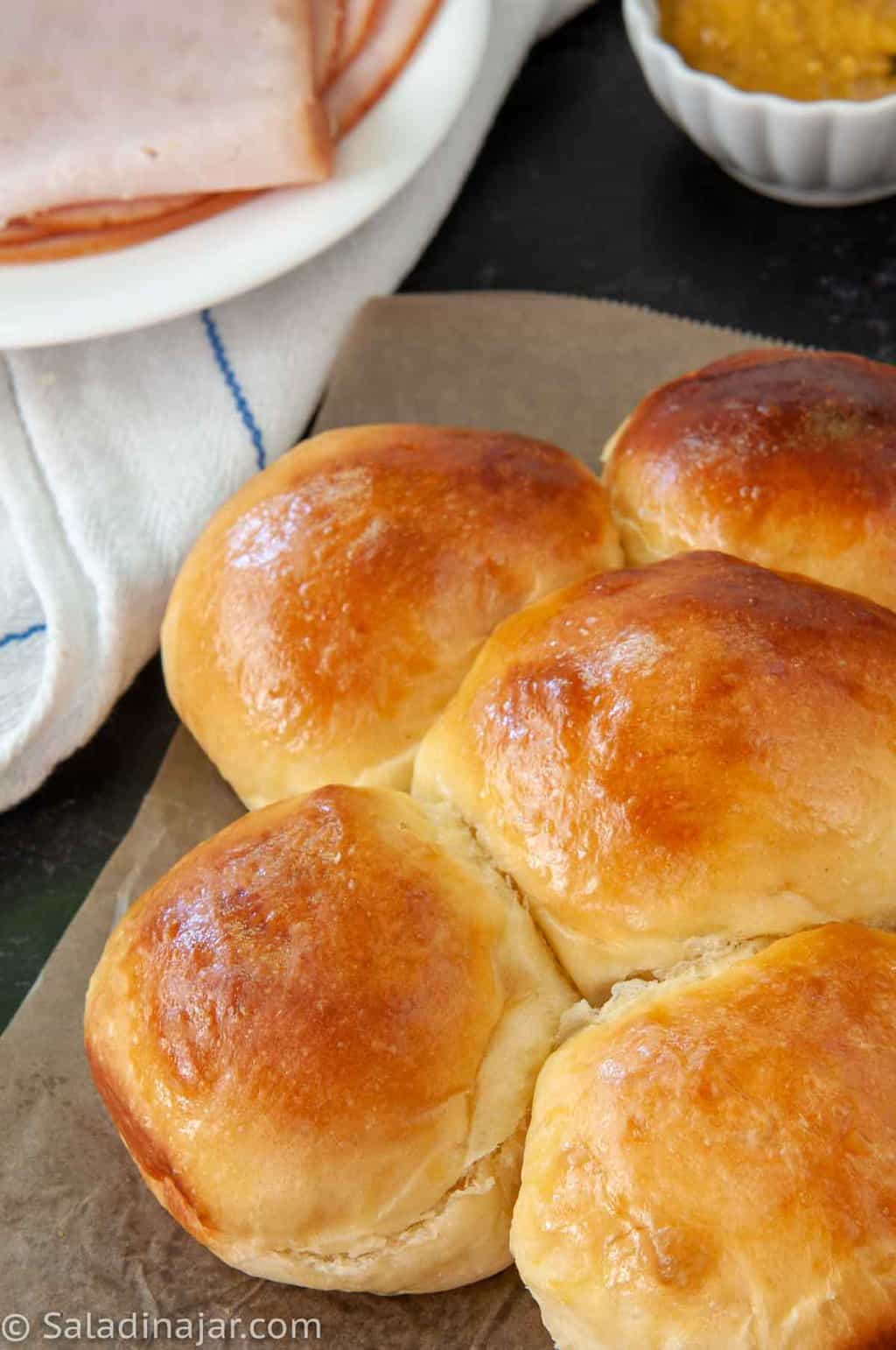 a clone recipe of King's Hawaiian Bread Rolls with sandwich makings on the side