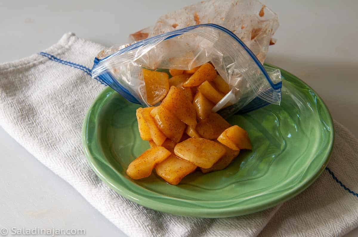 cooked apples coming out of a plastic bag