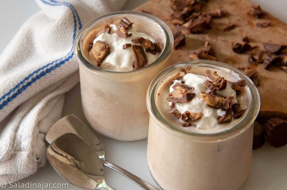 peanut butter cup yogurt --two servings with spoons on the side