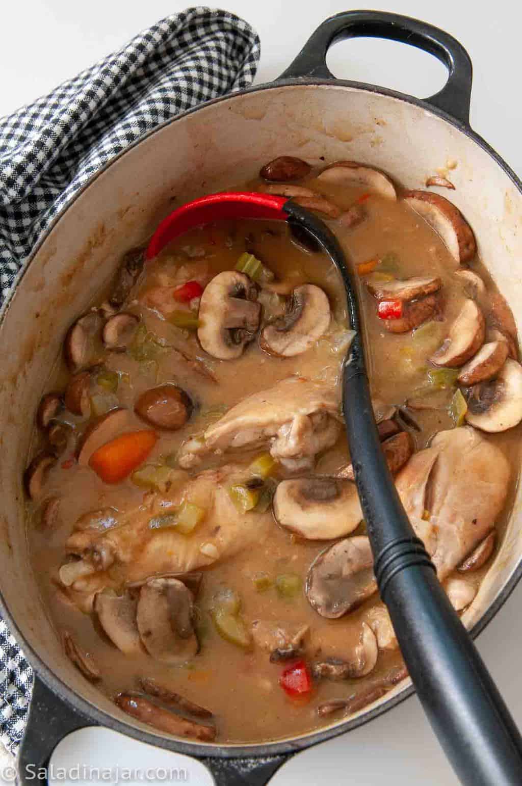 pot of chicken and vegetables simmering in large pot