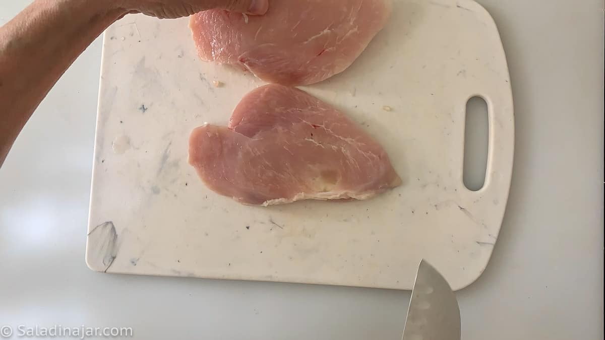 cutting chicken breast in half horizontally