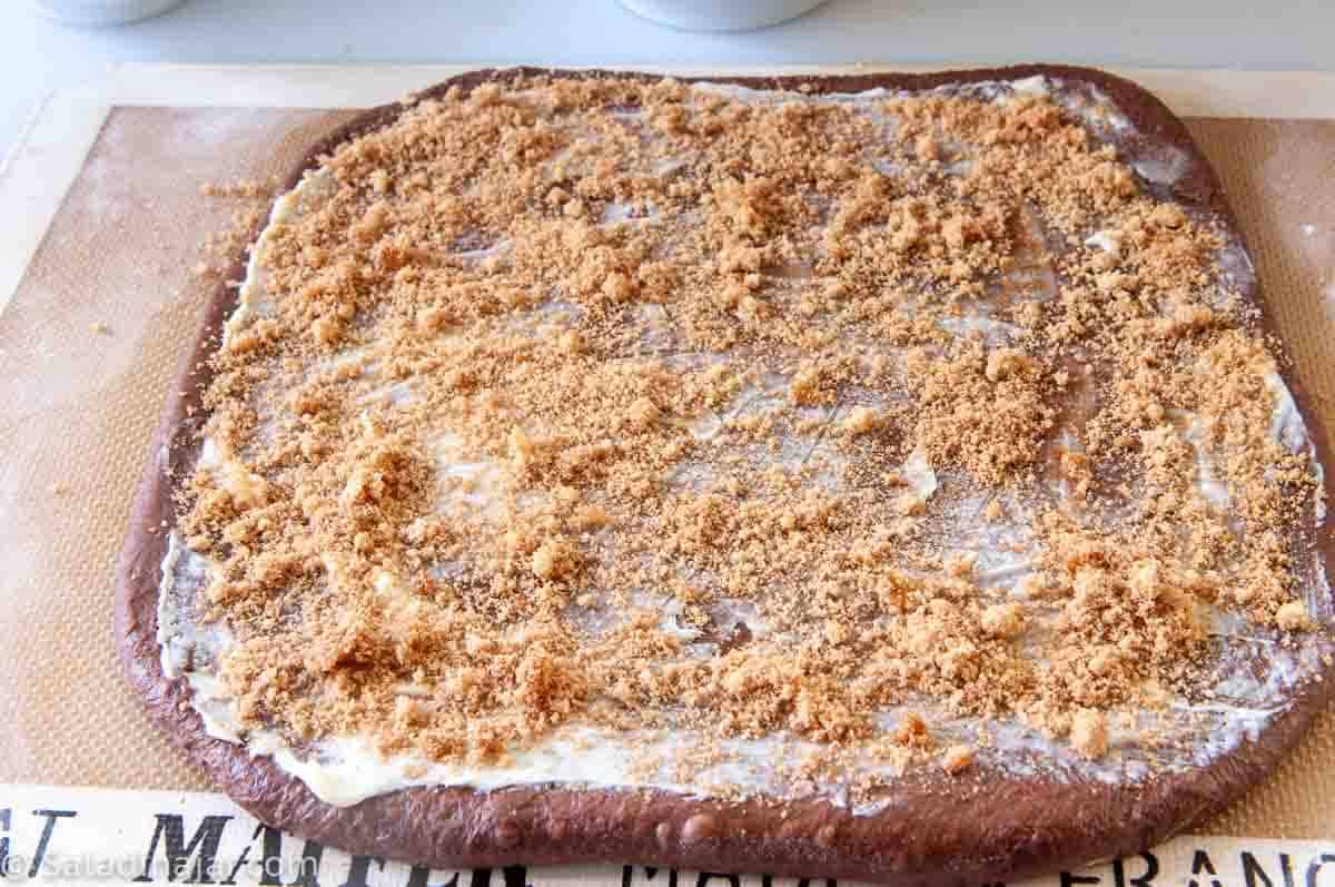 cinnamon-sugar sprinkled over dough