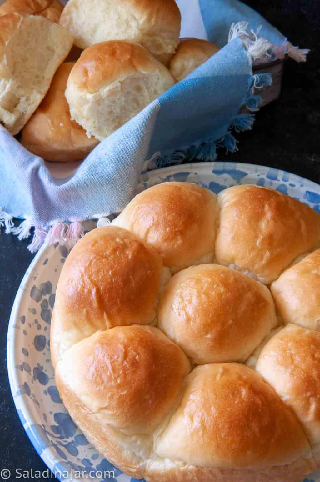 classic dinner rolls on a plate and in a basket