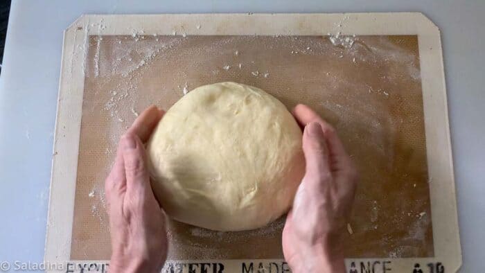 forming dough into a ball after removing from bread maker