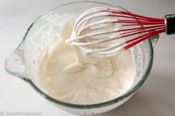 whisking yogurt with a whisk