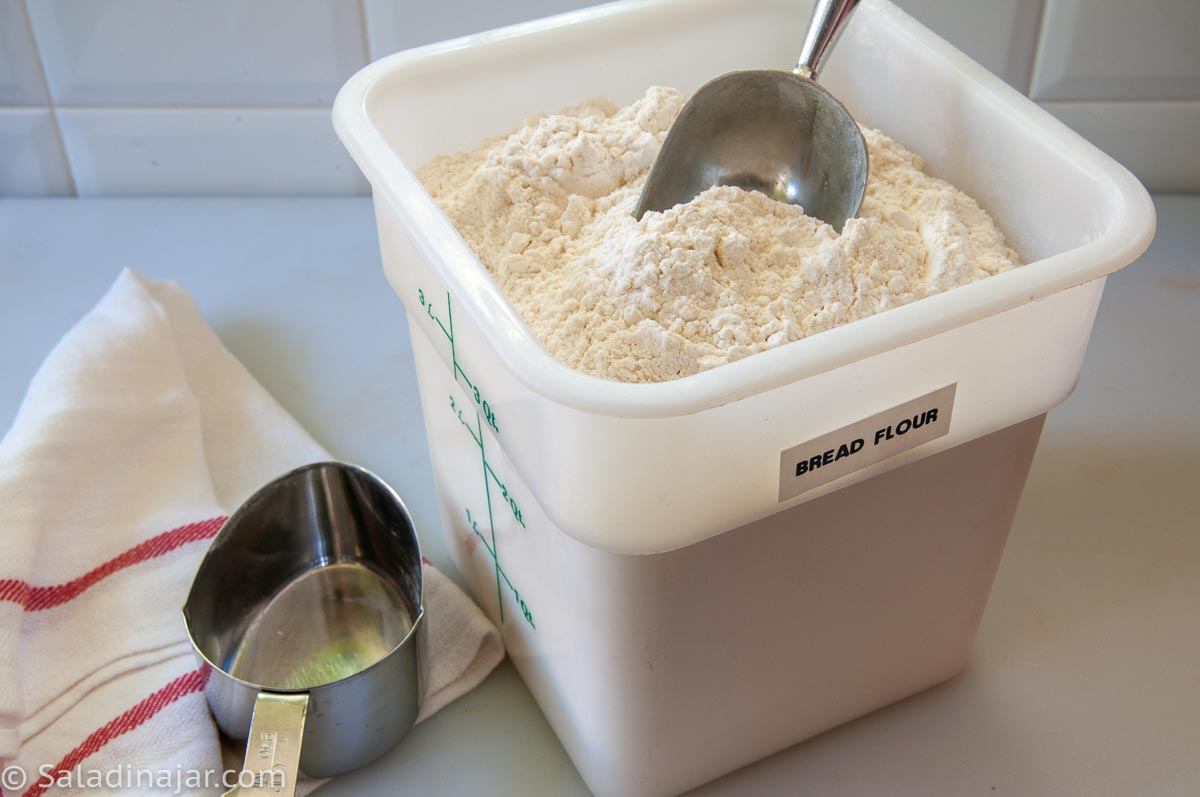 flour in a container with a scopp