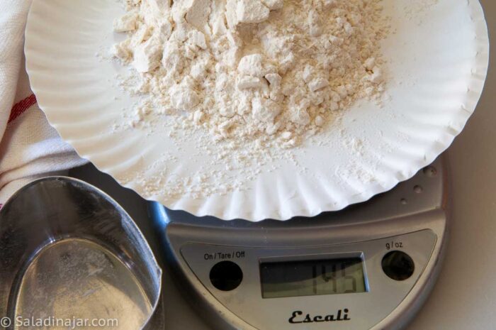 measuring a cup of flour that was incorrectly measured by a "scooper"