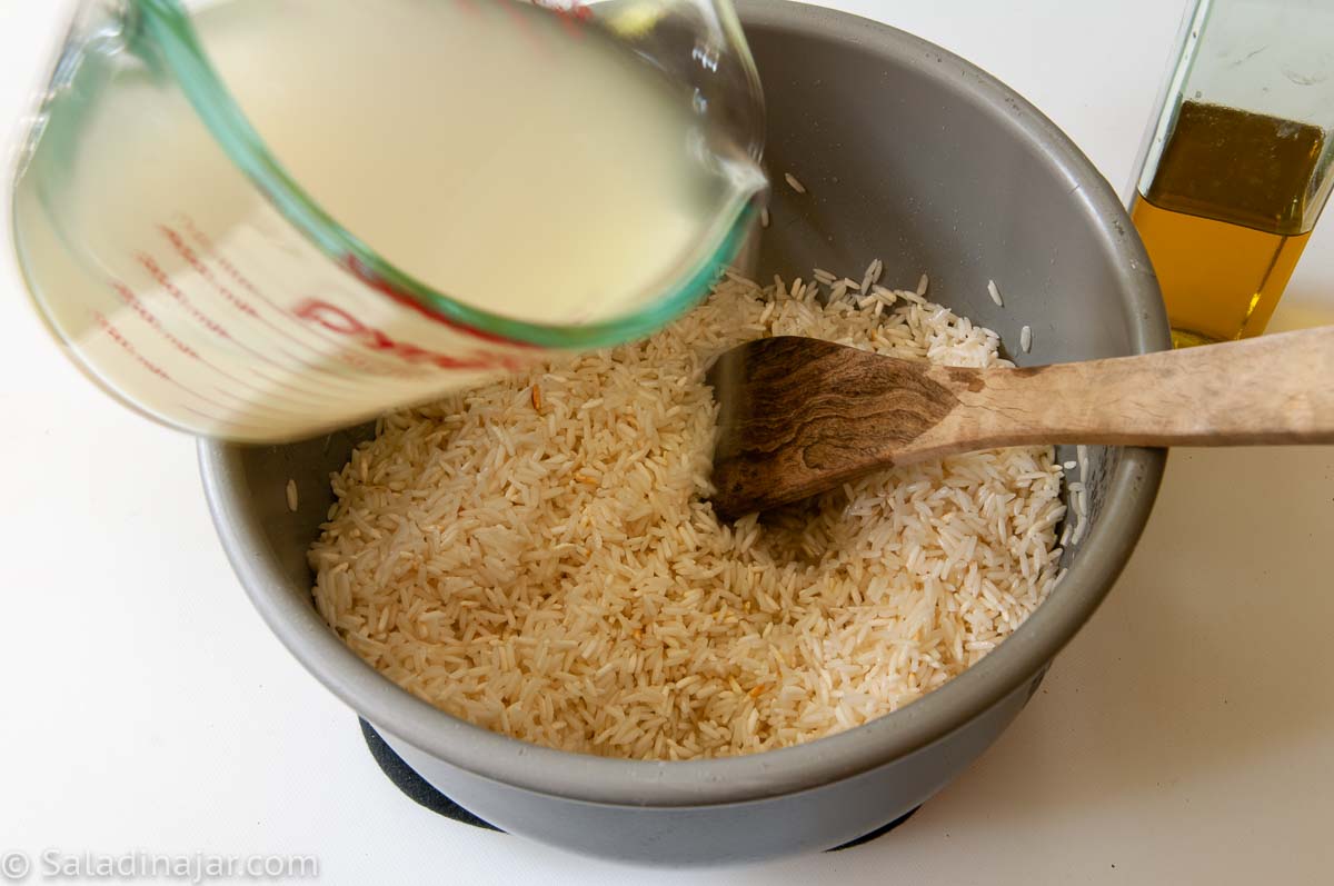 pouring water in the rice pot.