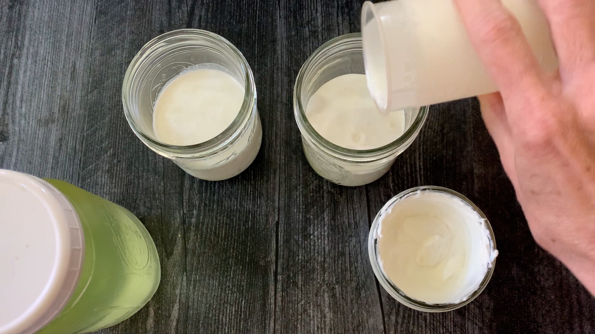 adding heavy cream to jar.