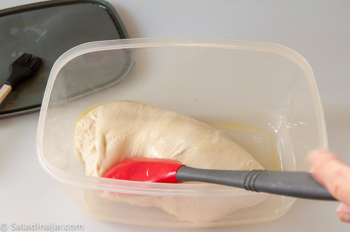 turning dough to coat with oil