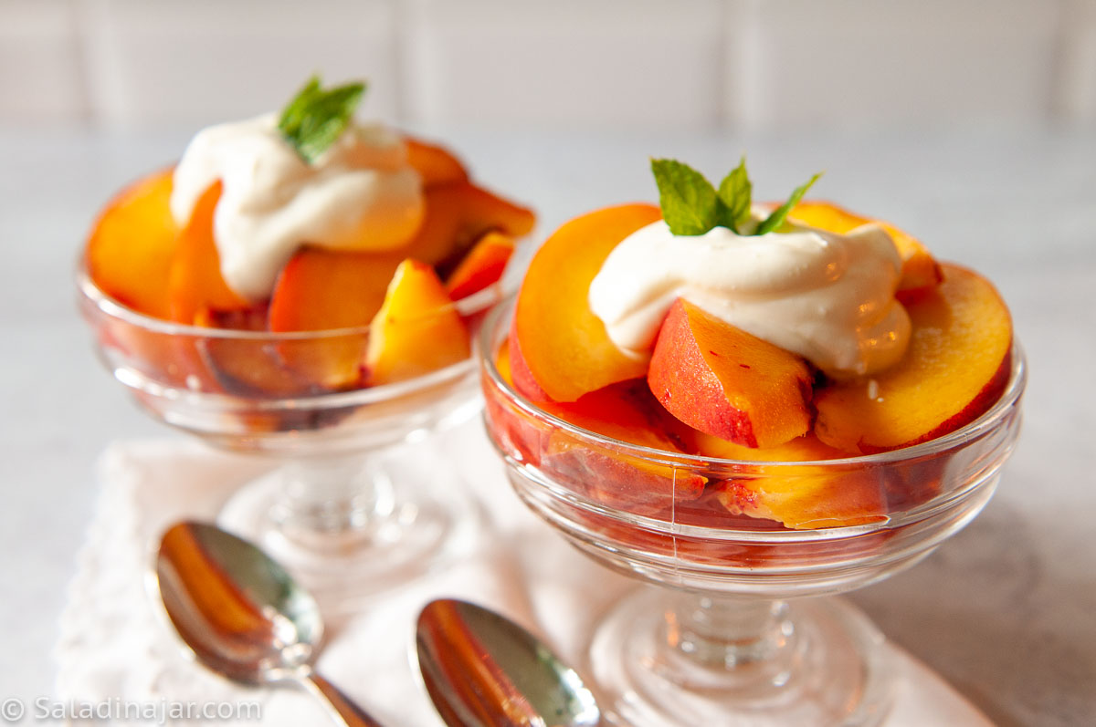 crème fraîche on top of fresh peaches