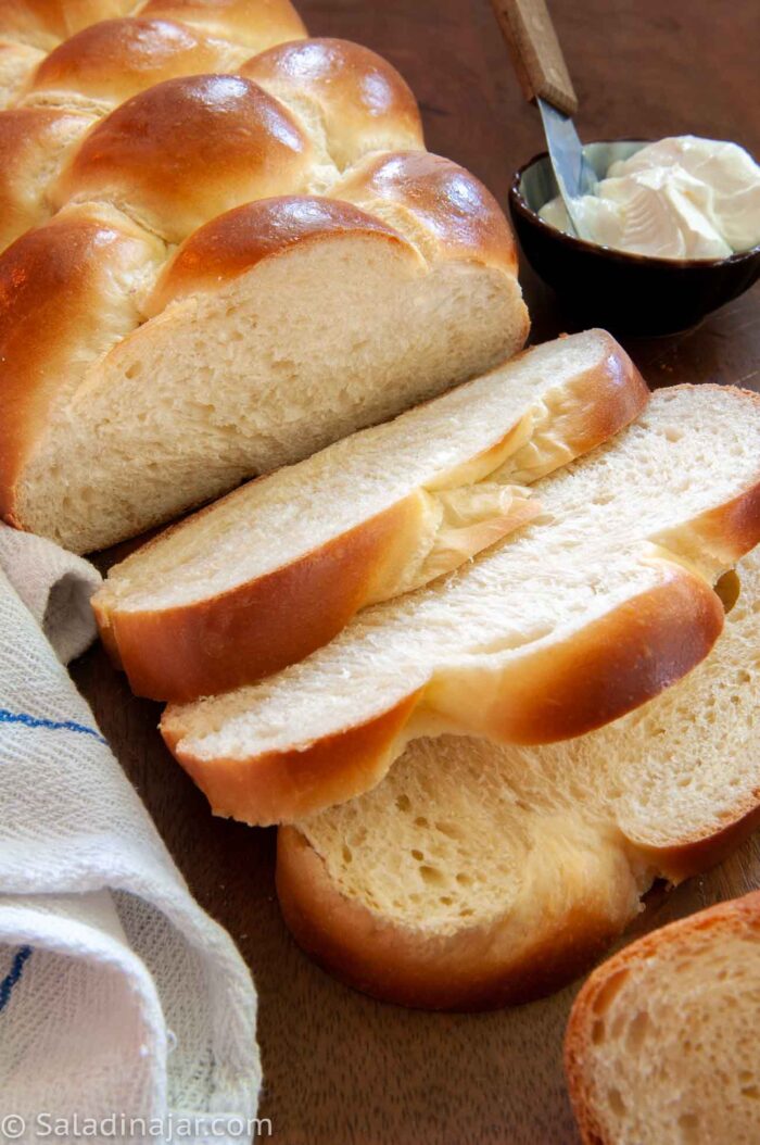 sliced Challah with softened butter