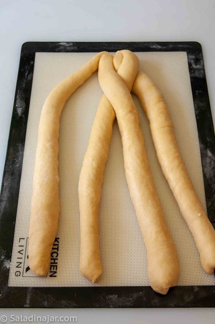 continuing the 4-strand braid.