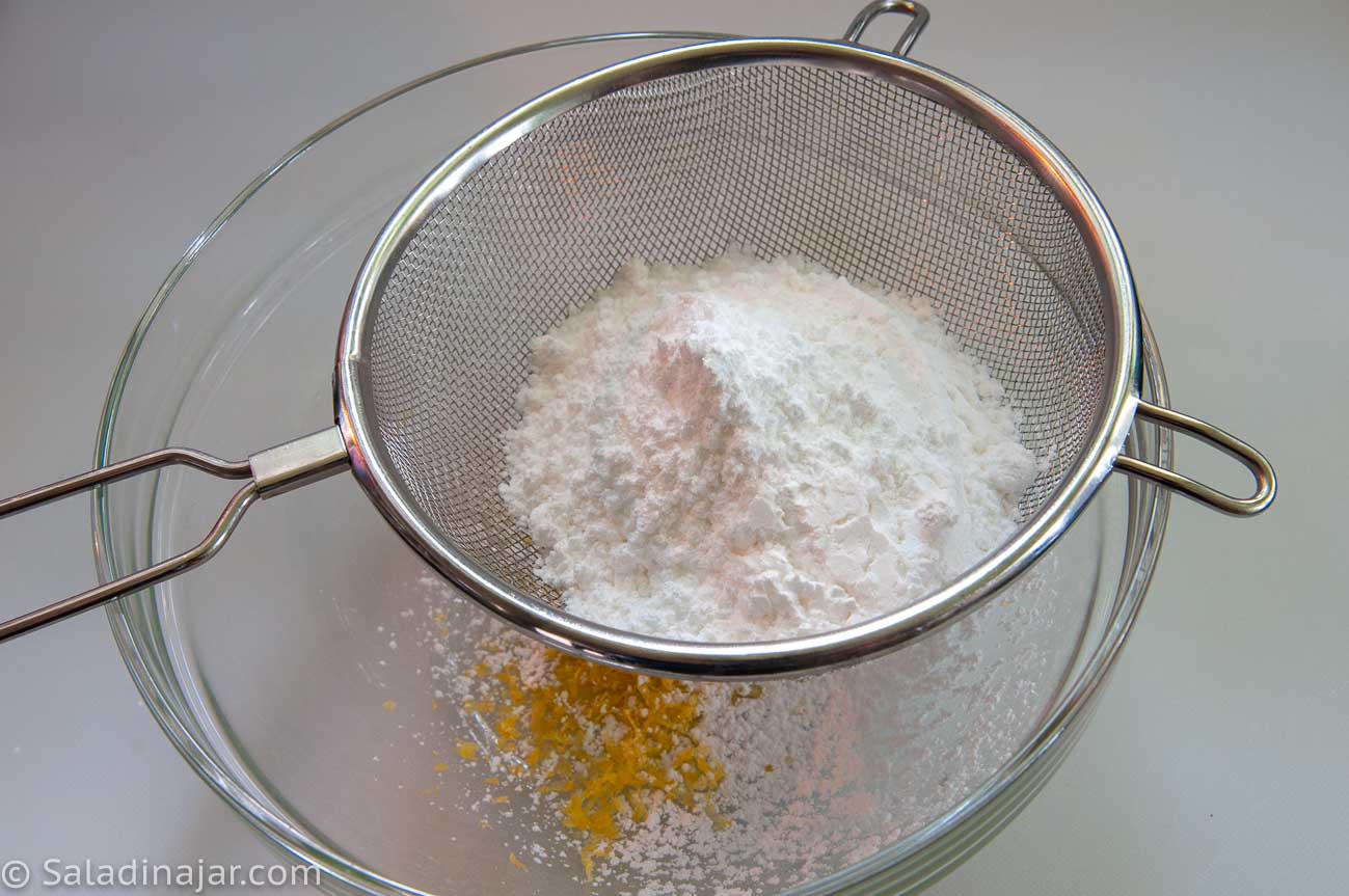 sifting sugar into a small bowl