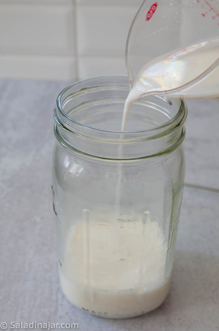 pouring milk into jar