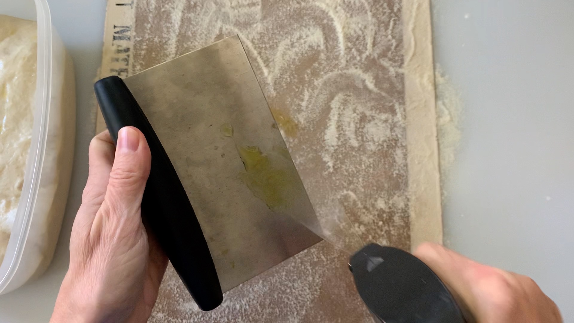 spray a bench scraper with olive oil