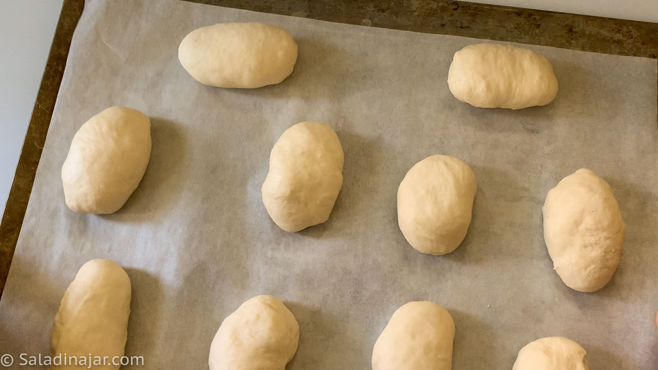 oval dough balls on prepared cookie sheet