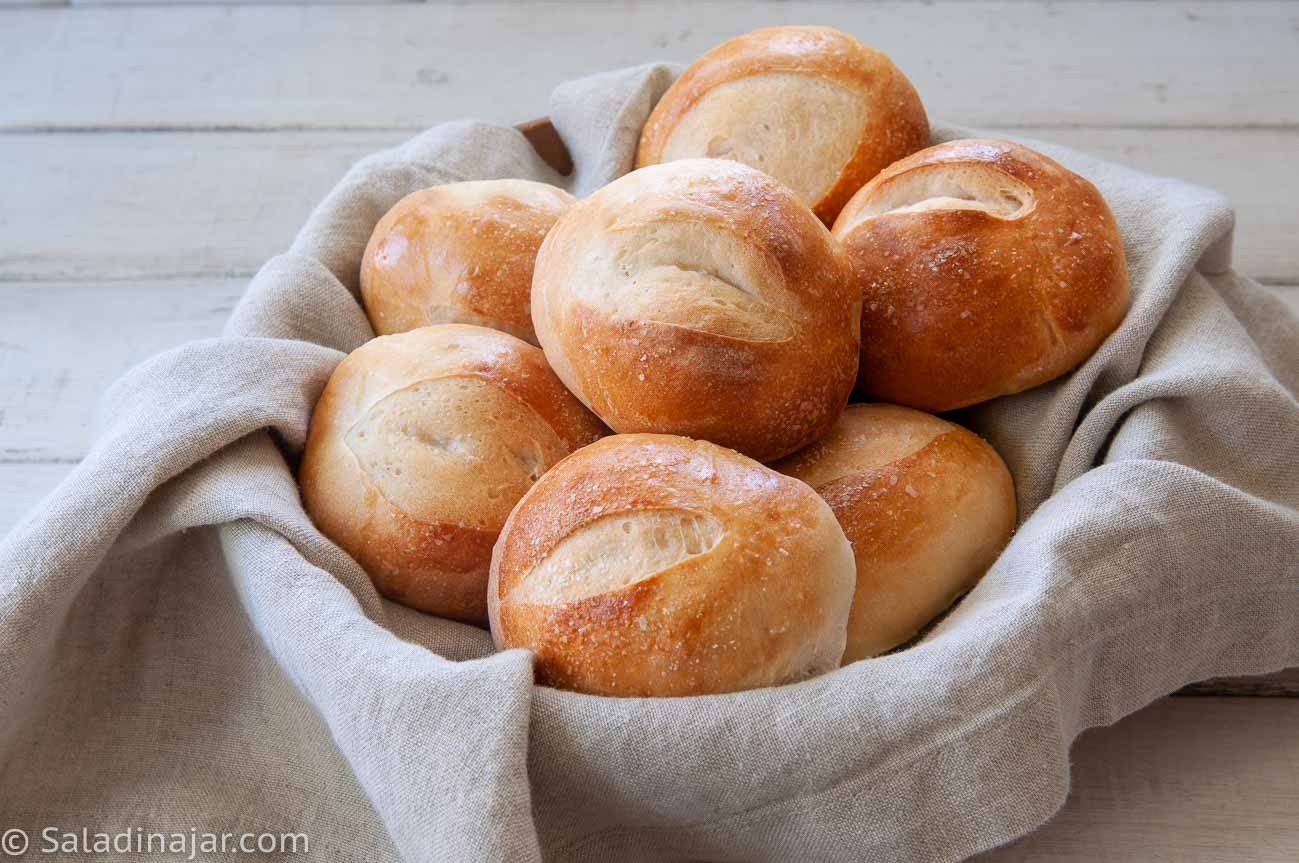 basket of sourdough dinner rolls made with a starter