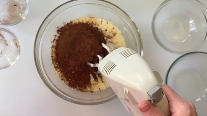 Mixing in flour and cocoa.