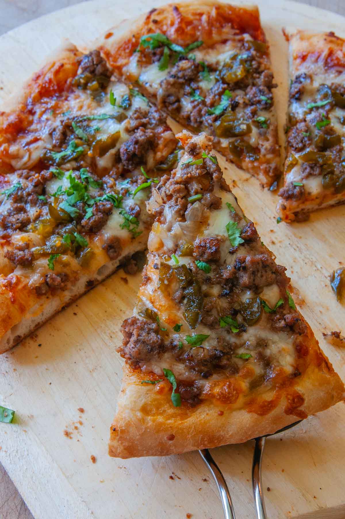 pizza made with bread machine pizza dough sliced and ready to eat