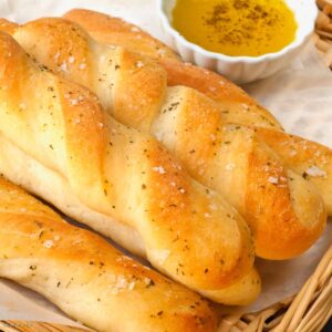 garlic breadsticks on a serving platter