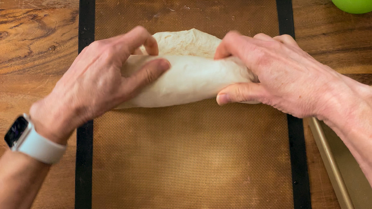 Rolling up loaf with hands