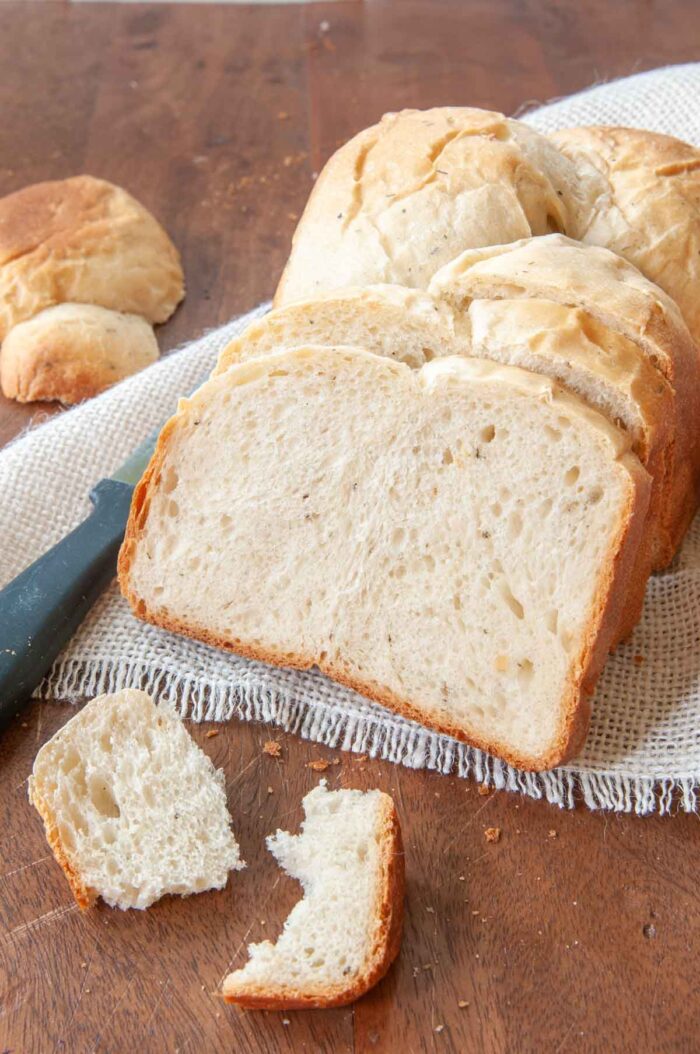 cliced herbal white bread mixed and baked in a bread machine