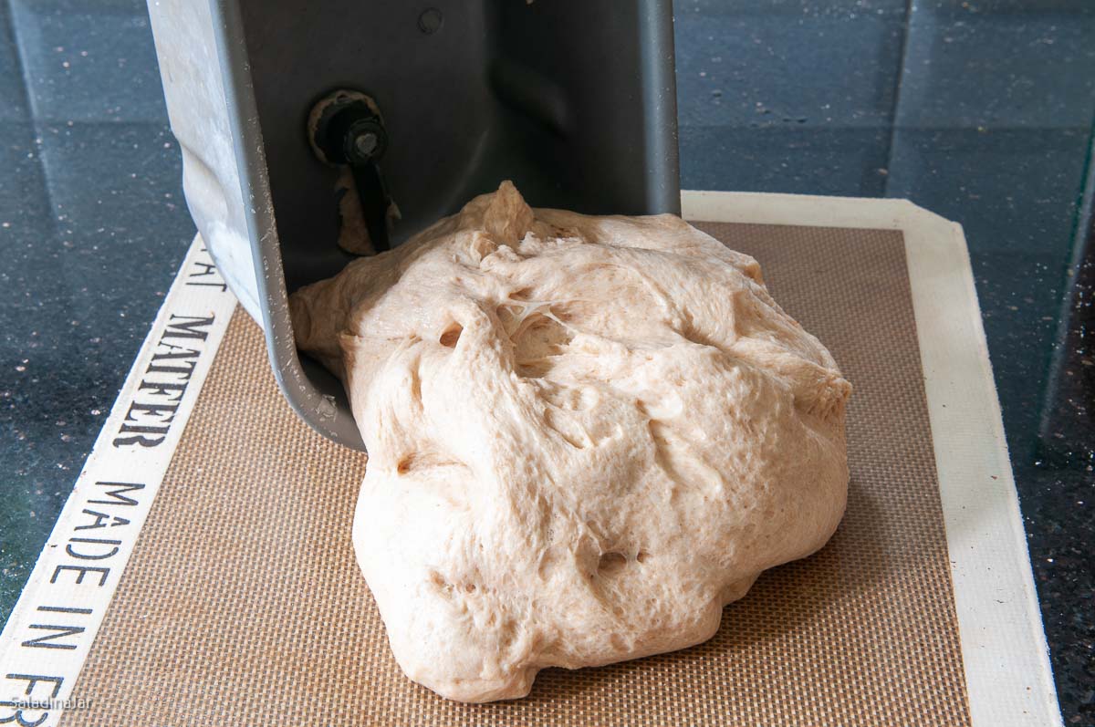 removing the dough from the bread machine pan