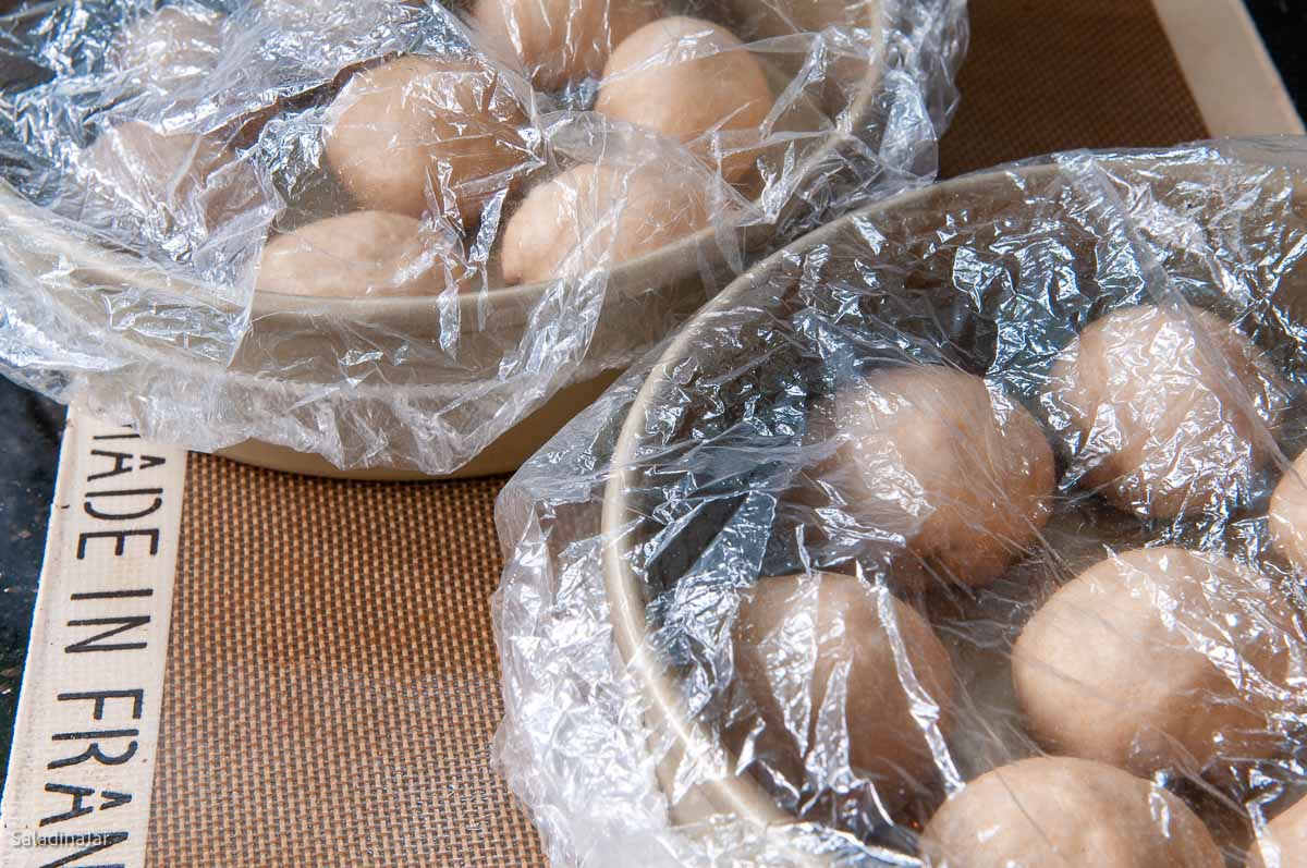 using shower cap to cover dough balls while rising