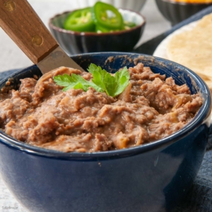 refried beans and beef in a bowl