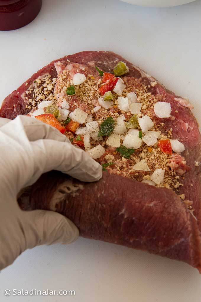 Rolling the stuffed steak