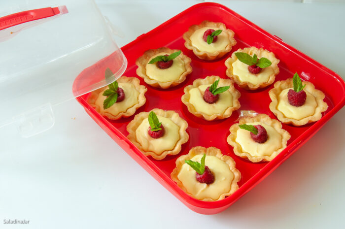 an easy and cheap way to carry lemon tarts with Dollar Store plastic carrier
