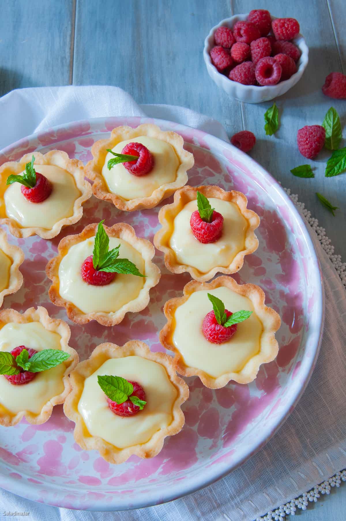 lemon mini tarts on a serving plate