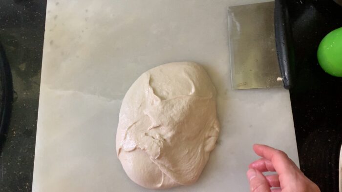 shaping into a tight ball with the help of a bench knife