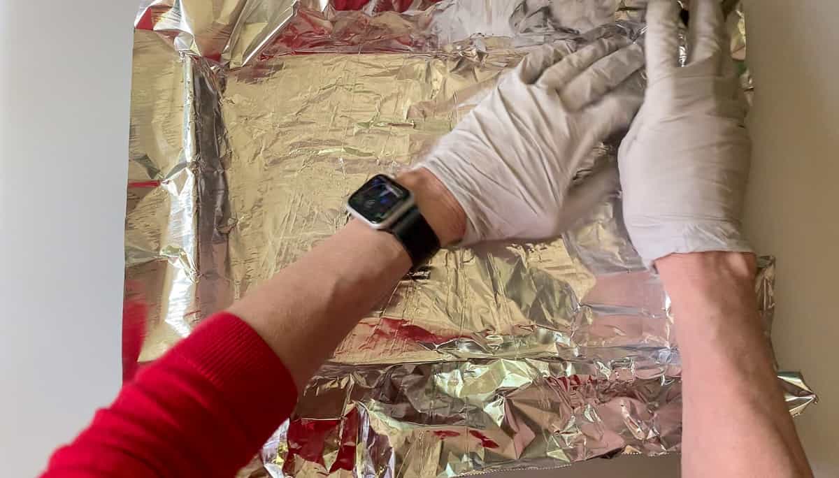 covering cookie sheet with foil.