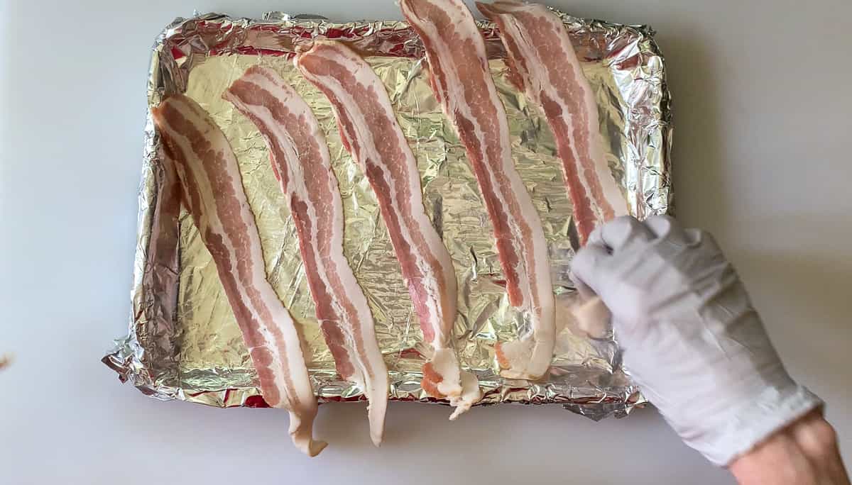 lay the bacon out on the tray
