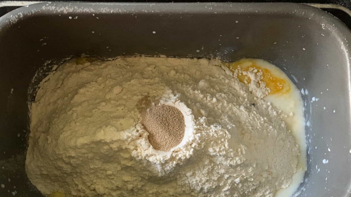 loading the bread machine pan before starting.