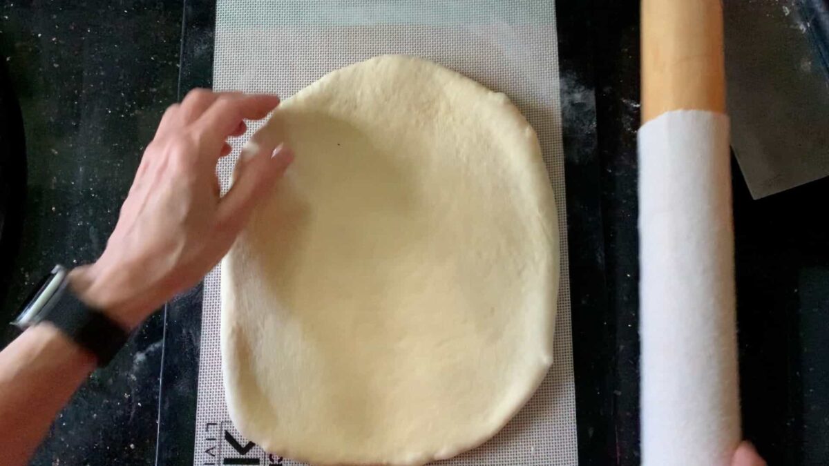 shaping the dough into a rectangle.